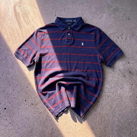 The same shirt after the AI Image Enhancer, on a sunlit concrete background