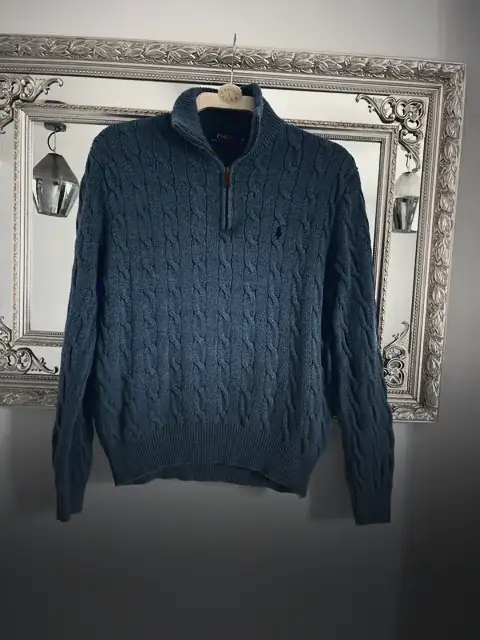 A blue Ralph Lauren cable knit quarter zip on a hanger, bought by AutoCop for £19.30
