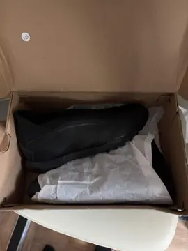 Black adidas Predator football boots in their box
